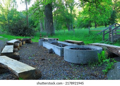 One Public Fireplace. Summer Time, Ready For Barbeque Party. Wooden Benches. No People. Stockholm, Sweden, Europe.