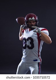 One Quarterback American Football Player Throwing Ball Isolated On Gray Background