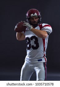 One Quarterback American Football Player Throwing Ball Isolated On Gray Background