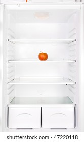 One Red Apple On Shelf In Empty Clean Refrigerator. Fruit In The Fridge.