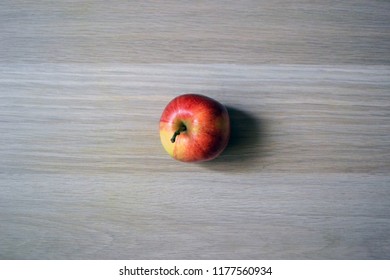 one red Apple on the table