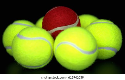 One red ball standing out among several green balls  - Powered by Shutterstock