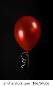 red balloons black background