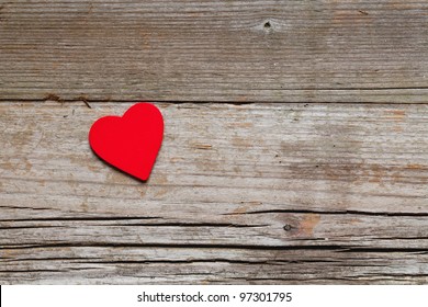 One red heart on rustic wood with copy space