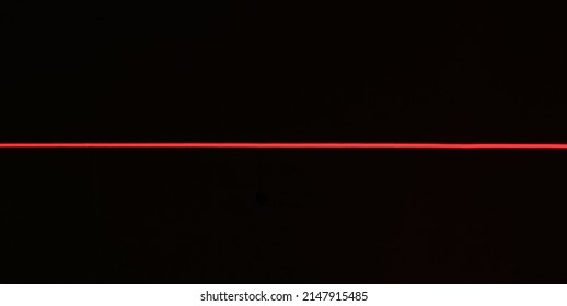 One Red Laser Line On A Black Background