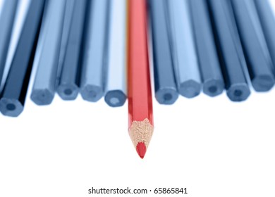 One Red Pencil Standing Out From Dull Pencils