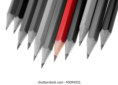 One Red Pencil Standing Out From Dull Pencils