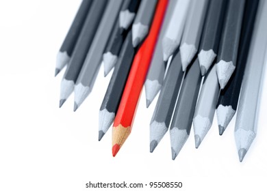 One Red Pencil Standing Out From Dull Pencils