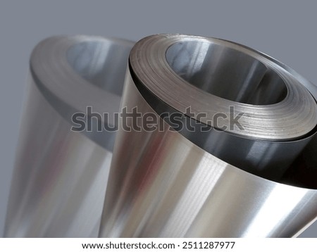 one roll of aluminum metal material with a gray background and shadow effect