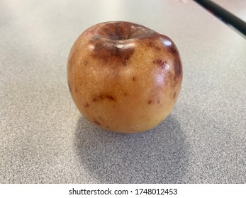 One Rotten Apple On A Table