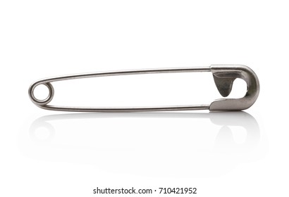 One safety pin made of iron isolated on the white background.  Detailed picture of one small closed safety pin isolated on the white background. Closed safety pin made of iron