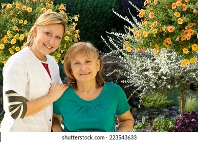 One Senior is being supervised by a nurse in a garden