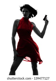 One Sexy Caucasian Woman Holding Gun In Silhouette Studio Isolated On White Background