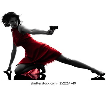 One Sexy Caucasian Woman Holding Gun In Silhouette Studio Isolated On White Background