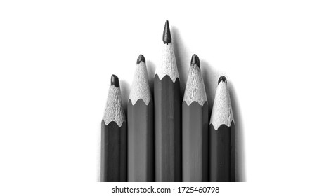 One sharpened pencil standing out from the blunt ones  It's easy to be beautiful if you do nothing concept  Red pencils white 