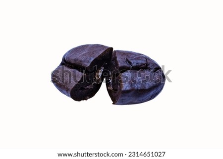 One shiny fresh roasted on top coffee beans brown damaged cut in half. Most traded agricultural commodities in world. Coffee contains caffeine refreshing body. isolated on white background cutout.
