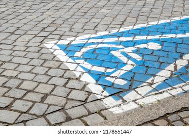 One Single Blue Marked Parking Spot For The Disabled, Outdoors Pavement Symbol Painted On, City Street, Nobody, Closeup. Parking Place For The Disabled, Transportation Accessibility, People Transport