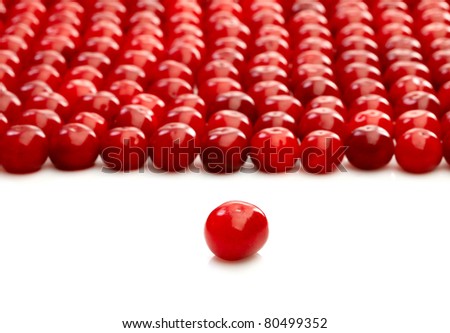 One single cherry and group of cherries over white