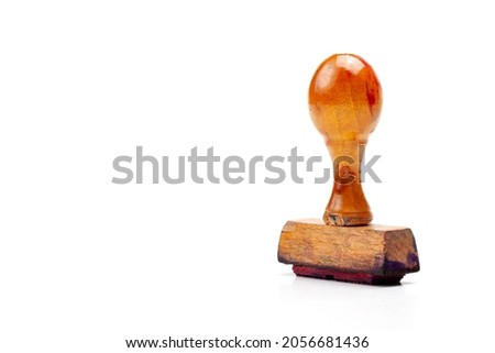 One single old simple post rubber stamp, stamper isolated on white background, cut out, copy space. Small retro vintage stamp up close. Approval and approving, sending mail abstract concept, nobody