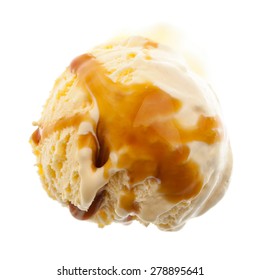 One Single Scoop Of Vanilla With Caramel Sauce From Above Isolated On White Background