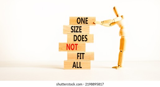 One Size Does Not Fit All Symbol. Concept Words One Size Does Not Fit All On Wooden Blocks. Businessman Hand. Beautiful White Background. One Size Does Not Fit All Business Concept. Copy Space.