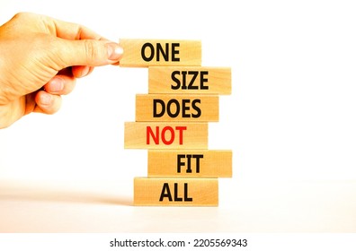 One Size Does Not Fit All Symbol. Concept Words One Size Does Not Fit All On Wooden Blocks. Businessman Hand. Beautiful White Background. One Size Does Not Fit All Business Concept. Copy Space.