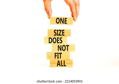 One Size Does Not Fit All Symbol. Concept Words One Size Does Not Fit All On Wooden Blocks. Businessman Hand. Beautiful White Background. One Size Does Not Fit All Business Concept. Copy Space.