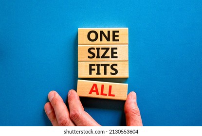 One size fits all symbol. Concept words One size fits all on wooden blocks. Businessman hand. Beautiful blue table blue background. One size fits all business concept. Copy space.