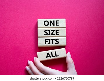 One Size Fits All Symbol. Concept Words One Size Fits All On Wooden Blocks. Beautiful Red Background. Businessman Hand. Business And One Size Fits All Concept. Copy Space.