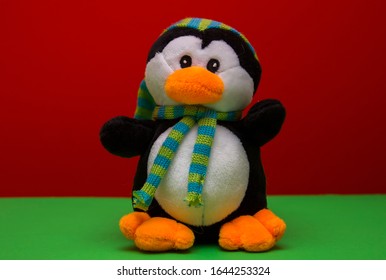 One Soft Toy  Penguin On Red Color Background