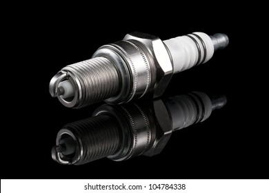 One Spark Plug On A Black Background.