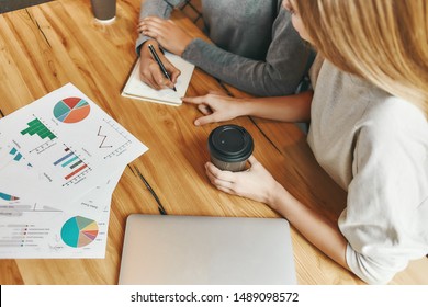 One Spirit, One Team. Businesswomen Have A Meeting In A Modern Cafe