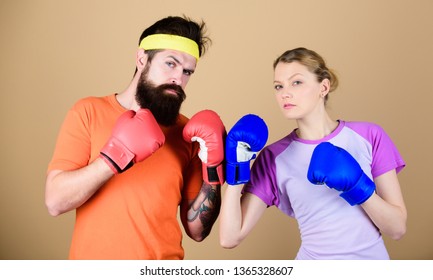 One Spirit, One Team, One Win. Punching, Sport Success. Sportswear. Fight. Training With Coach. Happy Woman And Bearded Man Workout In Gym. Knockout And Energy. Couple Training In Boxing Gloves.