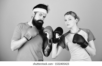 One Spirit, One Team, One Win. Punching, Sport Success. Sportswear. Fight. Training With Coach. Happy Woman And Bearded Man Workout In Gym. Knockout And Energy. Couple Training In Boxing Gloves.