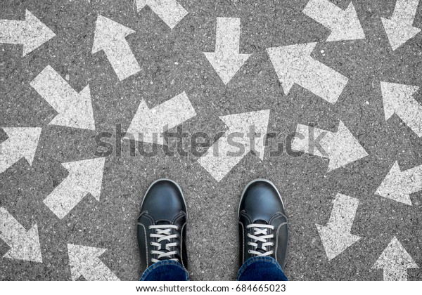 One standing on the road to future life with many\
direction sign point in different ways. Decision making is very\
hard to design.
