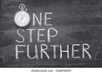 One Step Further Phrase Written On Chalkboard With Vintage Precise Stopwatch 

