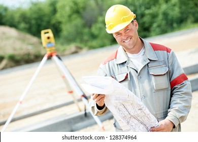 One Surveyor Worker Working With Theodolite Transit Equipment At Road Construction Site Outdoors