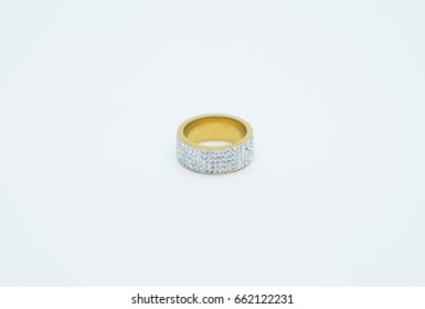 One Thick Gold Ring Embedded With Cubic Zirconia In Five Rows, Isolated On A Light Background