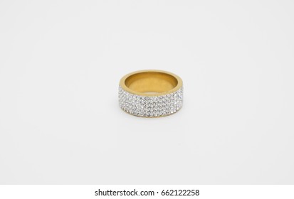 One Thick Gold Ring Embedded With Cubic Zirconia In Five Rows, Isolated On A Light Background