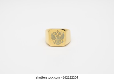 One Thick Men's Gold Signet Ring With A Picture Of The Double-headed Eagle Isolated On White Background