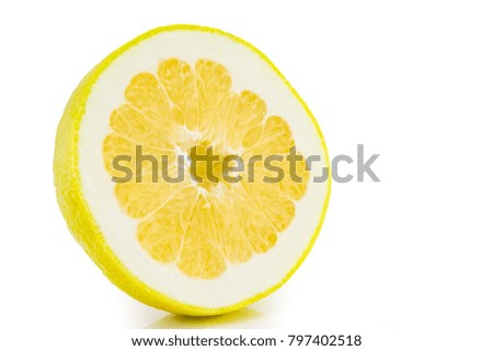 one thin slice of ripe grapefruit on a white background.