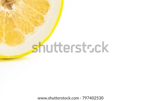 one thin slice of ripe grapefruit on a white background.