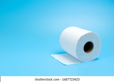 One Toilet Paper Roll Isolated On Blue Background