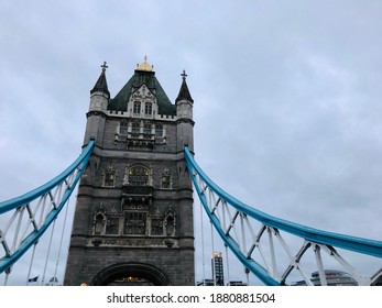 One Of The Tower In Tower Bridge, London Photographed From Below The Tower Against The Backdrop Of Typical Grey London Sky On 2 January 2020.
