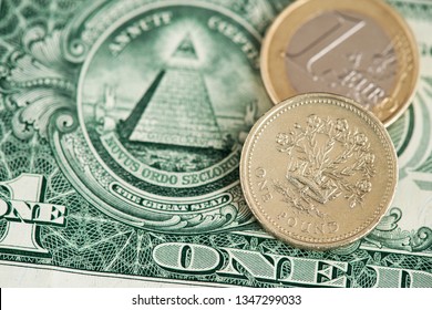 One US Dollar Banknotes With Pound Sterling And Euro Coin.