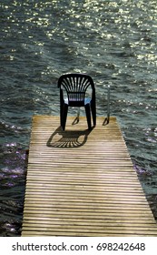 One Vacant Place Available, Empty Chair By A Lake