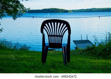 One Vacant Place Available, Empty Chair By A Lake