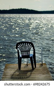 One Vacant Place Available, Empty Chair By A Lake