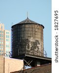 One very old wood water tank.  Historical view point: were built after year 1871.