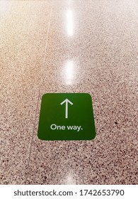 One Way Aisle Sign In A Grocery Store Floor To Promote Social Distancing While Shopping